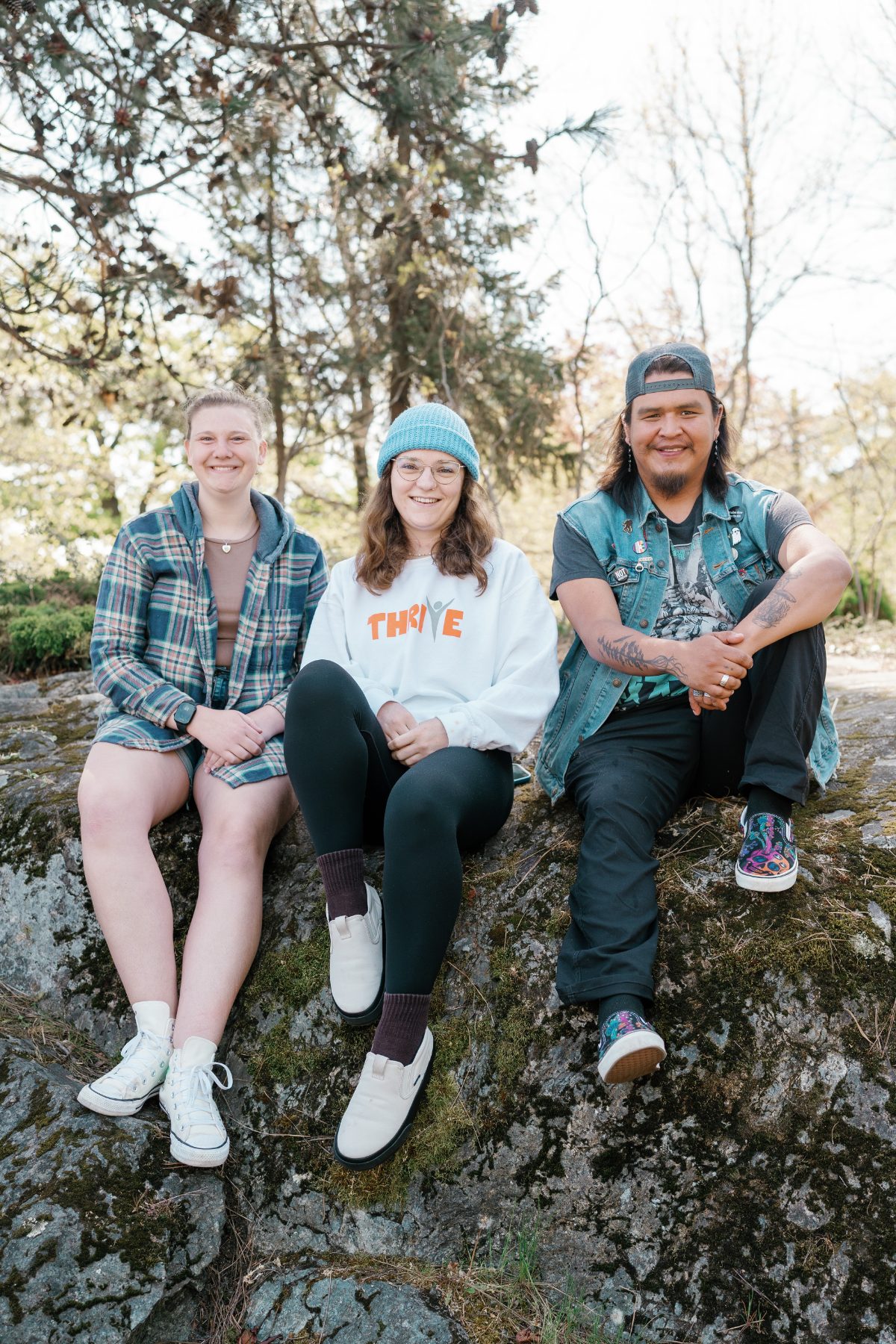 Three members sitting together outdoors at the National Forum